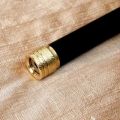 Chatter style brass thread protector ring on matte black coated LW barrel, close-up