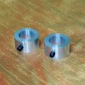 Pair of aluminium barrel bushes scribed for position