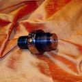 Valve body fully jewelled showing polished and enamel inlaid burst disc plug
