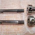 Valve stem and hat, original and Leupy replacement