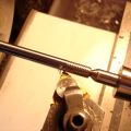 Valve stem thread cutting (note threadform tip)