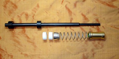 Barrel with spacers, spring centraliser, spring & hammer, showing assembly order
