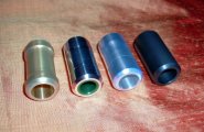 left to right, plastic sleeved brass, aluminium with oil filled central core, aluminium with PTFE sleeving, and high-tech plastic